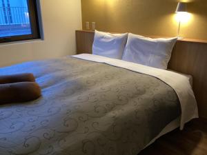 Postel nebo postele na pokoji v ubytování Mito Hotel Season