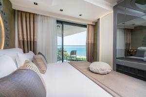 Postel nebo postele na pokoji v ubytování Simus Beach Hotel + 33 fotografií