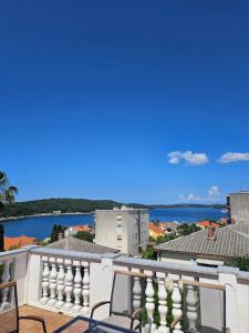 a view of the water from the balcony of a building at Apartmani Jović 2 in Mali Lošinj