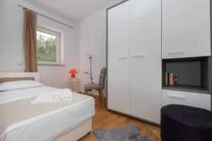 Postel nebo postele na pokoji v ubytování Holiday Home Rajna
