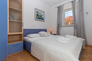 Postel nebo postele na pokoji v ubytování Holiday Home Rajna