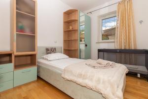 Postel nebo postele na pokoji v ubytování Holiday Home Rajna