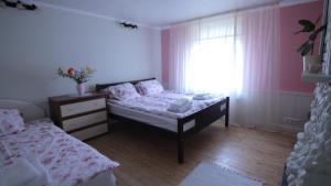 Ένα ή περισσότερα κρεβάτια σε δωμάτιο στο Ringi Guesthouse