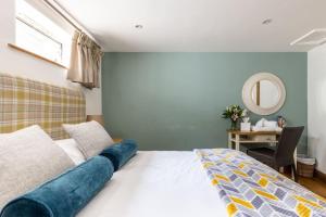 a bedroom with a bed with a large blue object on it at Duke House ground floor Apartment in Padstow