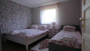 Ένα ή περισσότερα κρεβάτια σε δωμάτιο στο Ringi Guesthouse