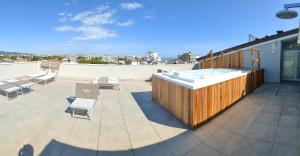 a hot tub on the roof of a building at Wally Residence in Rimini