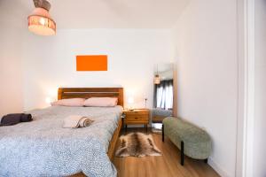 a bedroom with a bed and a desk and a chair at Book Jet - Casilla de Costa Dreams in Villaverde +29 photos