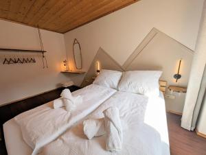 Tempat tidur dalam kamar di Neu! Moderner bayrischer Flair vor Pilatushaus