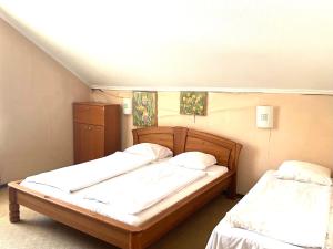 two beds in a small room with two bedsvisor at Sun Shine Apartments in Jūrmala +10 photos