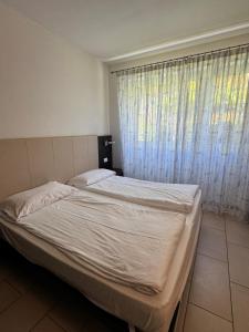 Posteľ alebo postele v izbe v ubytovaní Casa Piccola FeWo