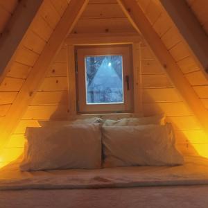 a bed in a room with a window at Martin in Nikšić
