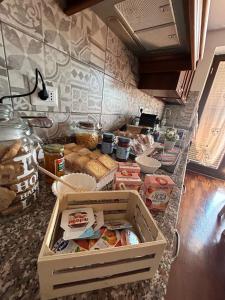a kitchen with a counter with food on it at I 4 mori in Fiumicino