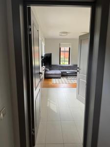 a view of a living room from the hallway at Karkle SummerHOUSE, sea view villa in Karklė