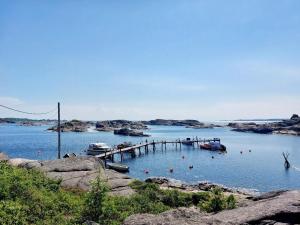 a dock with boats in a large body of water at Solheim in Ormelet