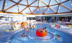 a group of people playing in a swimming pool at HAUS BENICO -Pension- in Ernst