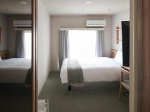 东京浅草筑波快速船舶酒店(Vessel Inn Asakusa Tsukuba Express)房間的床
