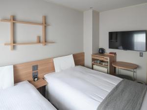 东京浅草筑波快速船舶酒店(Vessel Inn Asakusa Tsukuba Express)房間的床