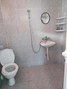 a bathroom with a toilet and a sink at Fa Mol in Sunny Beach +31 photos