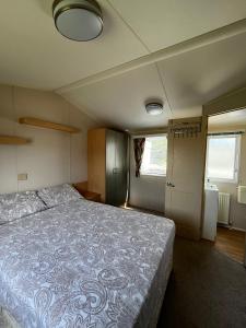 a bedroom with a large bed in a room at Seaview Holiday Rentals - Seawall in Whitstable