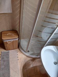 a bathroom with a shower and a toilet and a sink at Boho Zen Retreat in Agia Pelagia +15 photos