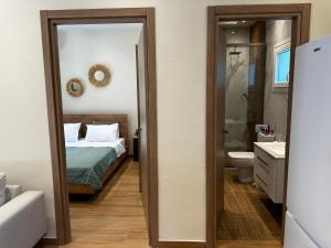 Postel nebo postele na pokoji v ubytování Gouvia Hideaway