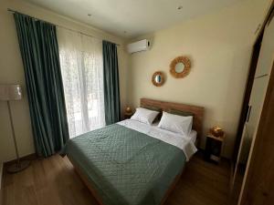 Postel nebo postele na pokoji v ubytování Gouvia Hideaway