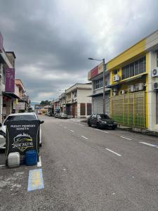 a car parked on the side of a street at Jb Sojourn in Skudai