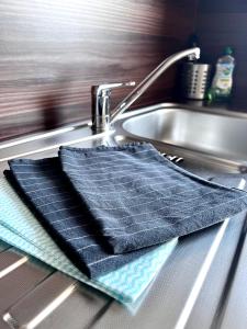 a towel is sitting on a kitchen sink at Apartment No.9 in Husum