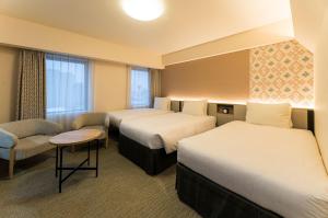 Postelja oz. postelje v sobi nastanitve Richmond Hotel Aomori