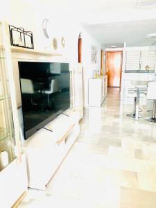 TV a/nebo společenská místnost v ubytování Villa Puerto Beach vistas al mar