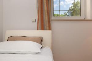 Postel nebo postele na pokoji v ubytování Holiday Home Rajna