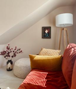 a living room with a couch and a lamp at Casita 10 Málaga, holiday home with roof terrace in Málaga
