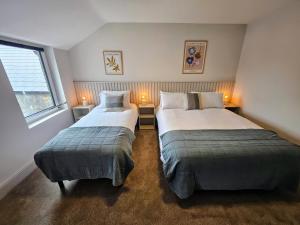 Voodi või voodid majutusasutuse Tatlers Guest House toas