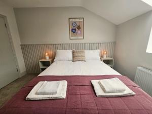 Voodi või voodid majutusasutuse Tatlers Guest House toas