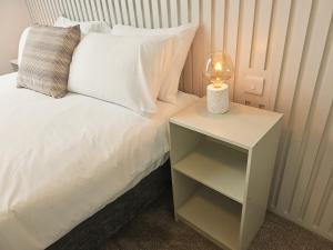Voodi või voodid majutusasutuse Tatlers Guest House toas
