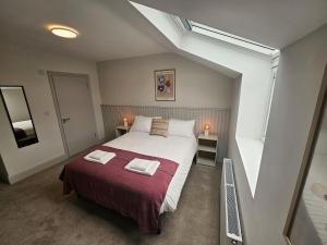 Voodi või voodid majutusasutuse Tatlers Guest House toas