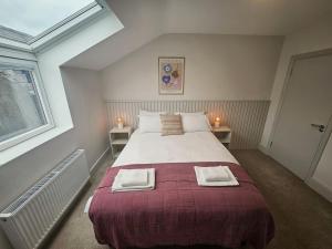 Voodi või voodid majutusasutuse Tatlers Guest House toas
