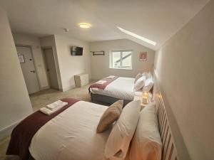 Voodi või voodid majutusasutuse Tatlers Guest House toas