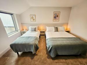 Voodi või voodid majutusasutuse Tatlers Guest House toas