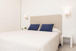 A bed or beds in a room at Hotel Capanni