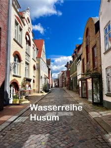 an empty street in a town with the words worcester healthcare museum at Apartment No.9 in Husum