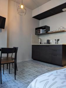 Η κουζίνα ή μικρή κουζίνα στο Le 12 wifi cosy parking 02 +2 φωτογραφίες