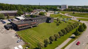 an aerial view of a building with a green park at Best Western Karlshamn Spa & Relax in Karlshamn