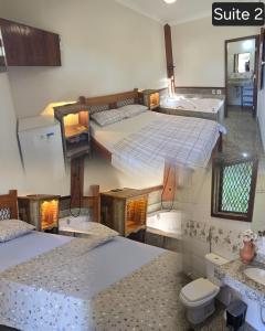 Un pat sau paturi într-o cameră la Pousada Fazenda do Prata Ecoresort