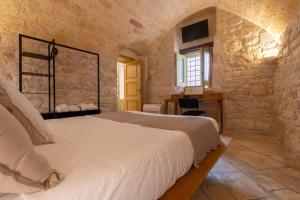 Postel nebo postele na pokoji v ubytování B&B Palazzo Vittoria
