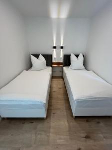 Katil atau katil-katil dalam bilik di Remise 23a - 2Schlafzimmer Unterkunft für 4-köpfige Familie