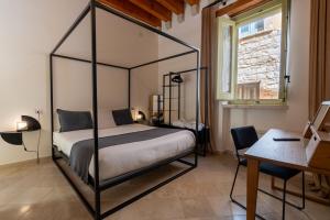 Postel nebo postele na pokoji v ubytování B&B Palazzo Vittoria