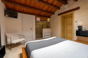 Postel nebo postele na pokoji v ubytování B&B Palazzo Vittoria