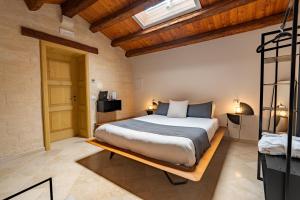 Postel nebo postele na pokoji v ubytování B&B Palazzo Vittoria