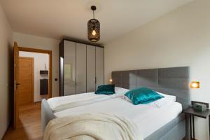 Voodi või voodid majutusasutuse Apartment Seeglück am Walchsee - sehr stylisch, zentral und neuerbaut toas
